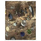 Assorted Charms and Pendants Including Crosses, Hearts, and Symbols