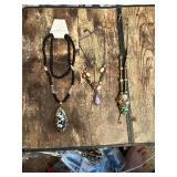 Beaded Necklace Collection including Black Beaded Necklace, Multicolor Stone Necklace, and Mask Pendant Necklace