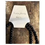 Beaded Necklace Collection including Black Beaded Necklace, Multicolor Stone Necklace, and Mask Pendant Necklace