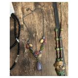 Beaded Necklace Collection including Black Beaded Necklace, Multicolor Stone Necklace, and Mask Pendant Necklace