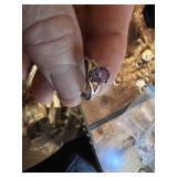 Vintage and costume ring collection including multi-stone band, solitaire rings, and gemstone accents