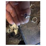 Vintage and costume ring collection including multi-stone band, solitaire rings, and gemstone accents