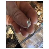 Vintage and costume ring collection including multi-stone band, solitaire rings, and gemstone accents