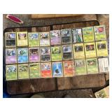 Lot of Pokemon Trading Cards including Grass, Psychic, Fire, and Electric Types