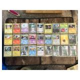 Lot of Pokemon Trading Cards including Grass, Psychic, Fire, and Electric Types