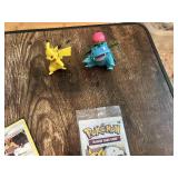 Pokemon Trading Card Game Tin with Cards, Pack, and Figures