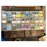 Lot of 54 Pokemon Trading Cards including Energies, Trainers, and Pokemon Characters.