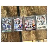 Lot of 4 Tom Brady Football Cards featuring Donruss and Score with Fantasy Studs and Patriots Highlights.