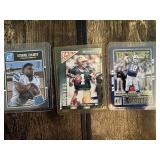 Lot of 3 Football Cards Featuring Peyton Manning, Brett Favre, and Ezekiel Elliott Rookie.