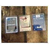 Lot of 3 Football Cards Featuring Peyton Manning, Brett Favre, and Ezekiel Elliott Rookie.