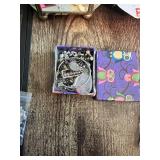 Assorted Jewelry Collection Including Earrings, Charms, and Accessories