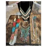 Collection of beaded necklaces and rosaries including multicolored designs