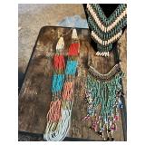 Collection of beaded necklaces and rosaries including multicolored designs