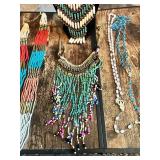 Collection of beaded necklaces and rosaries including multicolored designs