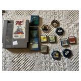 Old Nintendo, Nintendo DS, and PS2 video games, memory cards, and Star Wars collectible pieces including The Penguins Madagascar, Ben 10, and Mario Hoops 3-on-3.