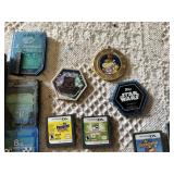 Old Nintendo, Nintendo DS, and PS2 video games, memory cards, and Star Wars collectible pieces including The Penguins Madagascar, Ben 10, and Mario Hoops 3-on-3.