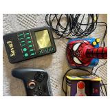 Electronic Games and Controllers Assortment including SteelSeries Controller, Various Handheld Electronic Games, and Spiderman Plug-and-Play Joystick
