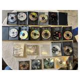 Multiple video games for PlayStation with titles such as Madden 99, Twisted Metal, and NBA Live 10.
