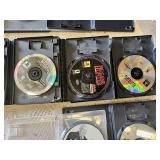 Multiple video games for PlayStation with titles such as Madden 99, Twisted Metal, and NBA Live 10.