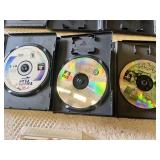 Multiple video games for PlayStation with titles such as Madden 99, Twisted Metal, and NBA Live 10.