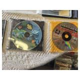 Multiple video games for PlayStation with titles such as Madden 99, Twisted Metal, and NBA Live 10.
