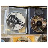 Multiple video games for PlayStation with titles such as Madden 99, Twisted Metal, and NBA Live 10.