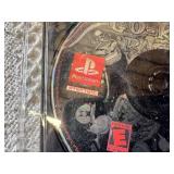 Multiple video games for PlayStation with titles such as Madden 99, Twisted Metal, and NBA Live 10.