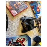 Superhero Collection including DVDs, Books, and Toys DVDs like Avengers: Age of Ultron and Superman Red Son, books such as Iron Man: The Gauntlet by Eoin Colfer, a Batman plush toy, a Marvel dartboard
