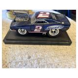 NASCAR Memorabilia Collection including Rusty Wallace Model Car, Corey LaJoie Autograph, NASCAR DVD, Monkey Plush, and Other Items