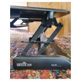 Lightly used cube corner pro plus 36 Varidesk Raising Desk for sitting and standing