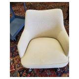 Highly collectable cushioned office chair on rollers