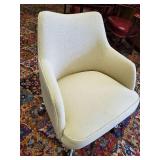 Highly collectable cushioned office chair on rollers