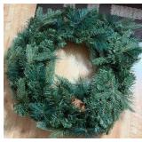 NearlyNature wreath with white lights and pine cones. Lights are battery powered with on/off/timer