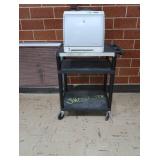 HP LASERJET 2600ON ON PLASTIC ROLLING CART