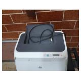HP LASERJET 2600ON ON PLASTIC ROLLING CART