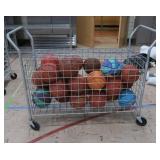 BASKETBALL CAGE ON WHEELS WITH LOTS OF BASKETBALLS