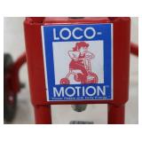 RED "LOCO MOTION" TRICYCLE