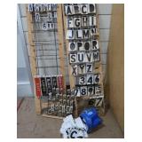 3 RACKS PLUS LOTS OF SELF REFLECTING LETTERS AND NUMBERS