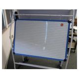 ROLLING 2 SIDED WHITE BOARD/EASIL