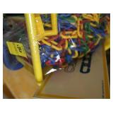 GREEN AND YELLOW TOTES FULL OF COLORFUL TOYS/CHAIN LINK TOY