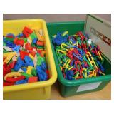 GREEN AND YELLOW TOTES FULL OF COLORFUL TOYS/CHAIN LINK TOY