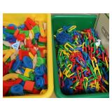 GREEN AND YELLOW TOTES FULL OF COLORFUL TOYS/CHAIN LINK TOY
