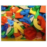 GREEN AND YELLOW TOTES FULL OF COLORFUL TOYS/CHAIN LINK TOY
