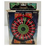 Miniature Criss 7 Cross Slot Machine Battery Operated 6" x 7 1/2" x 12 1/2" (Untested) And Casino Wheel With Original Box