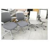 4 chairs - 2 are white and grey vinyl and 2 are grey fabric