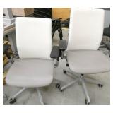 4 chairs - 2 are white and grey vinyl and 2 are grey fabric
