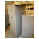 4 drawer file cabinet with a piece of desktop screwed to the top and a 2 door cabinet