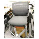 8 stacking chairs on wheels, 6 grey and 2 orange