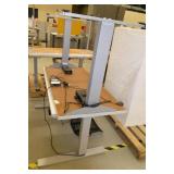 Two 24x48 adjustable height tables