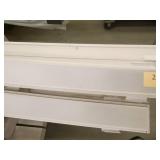 Pallet of led light fixtures 2-1/2 inches wide most are 12 ft long, approx 20